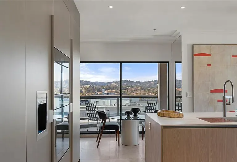 Kitchen island and dining area with views through the glass