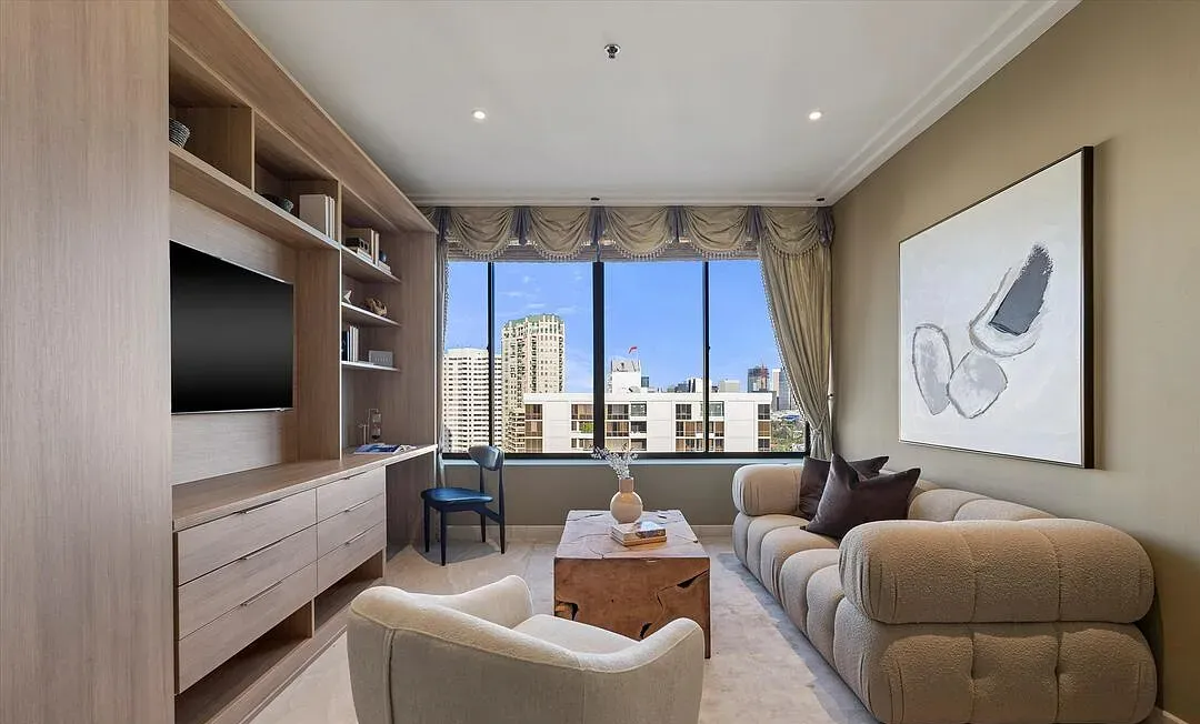 Family room with a wood media wall and sectional sofa