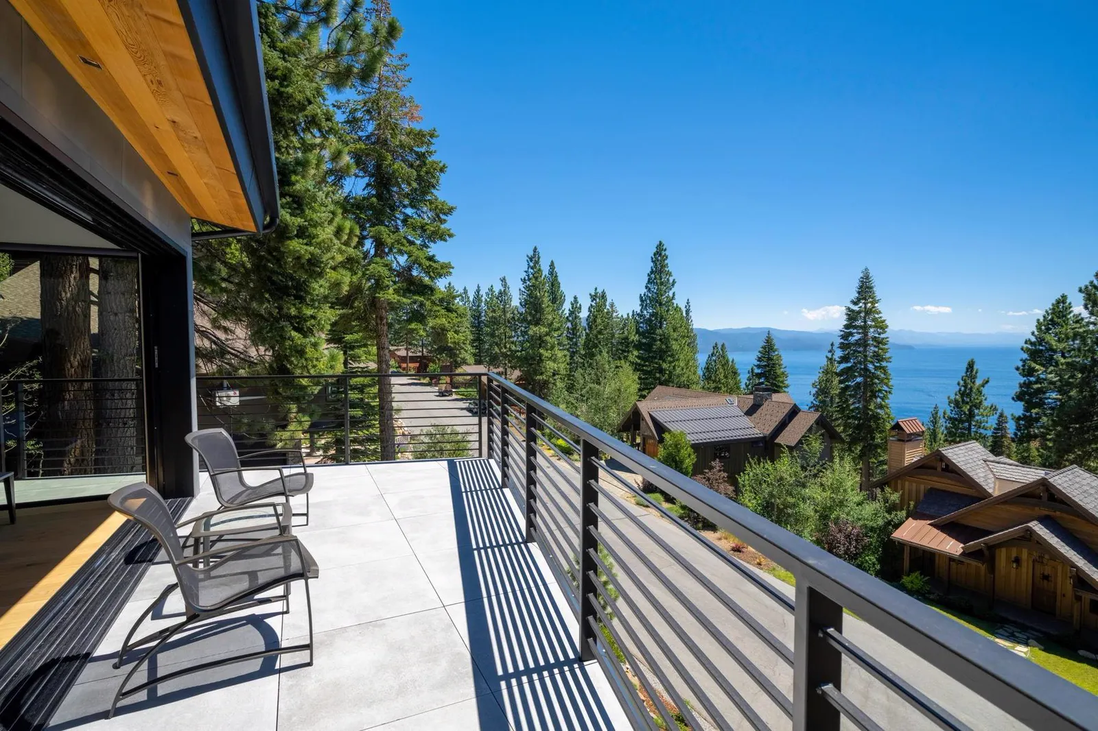 Deck with lounge chairs and a view of the lake