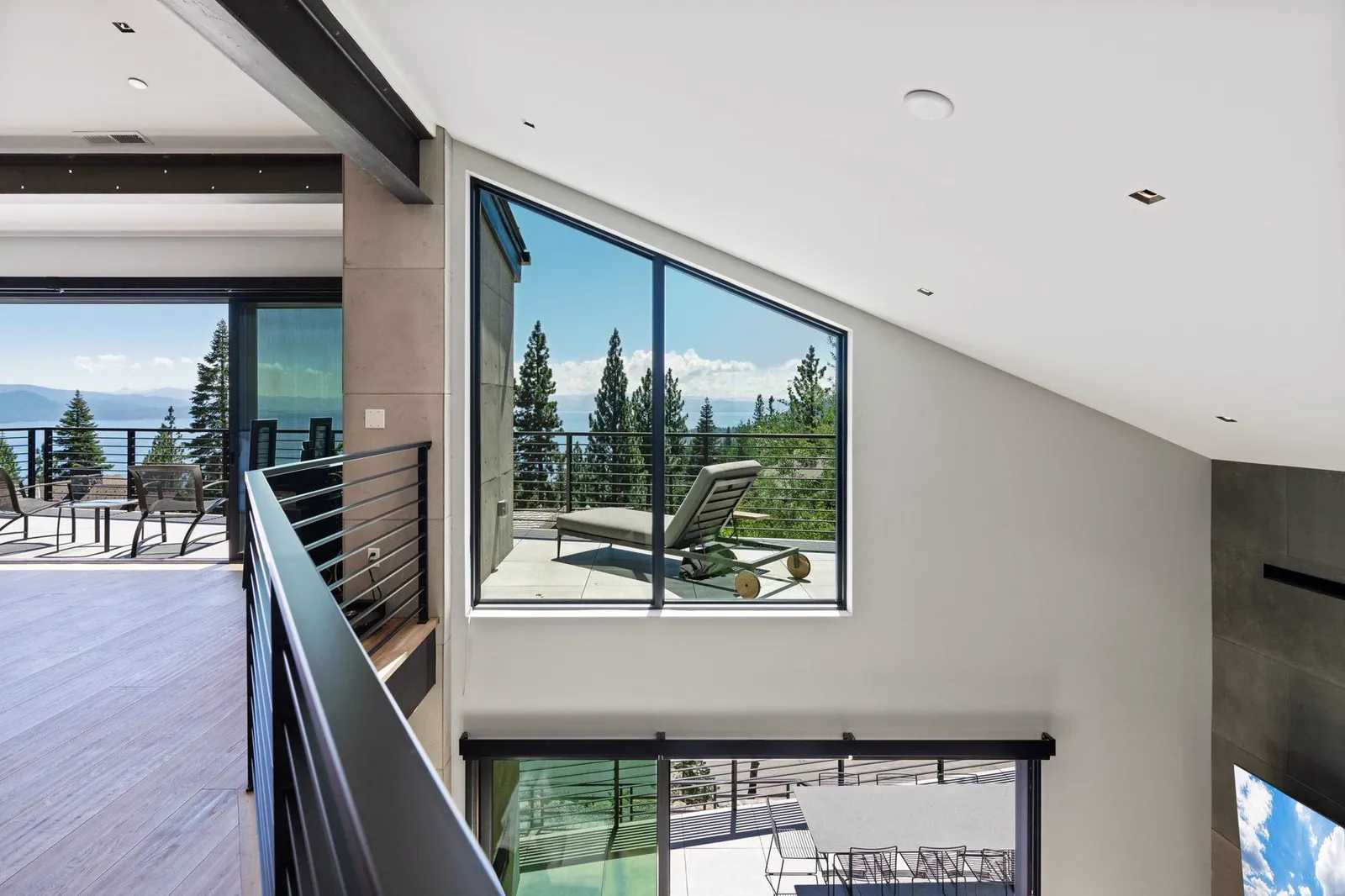 Upper hallway with a clerestory window and a view through to the deck