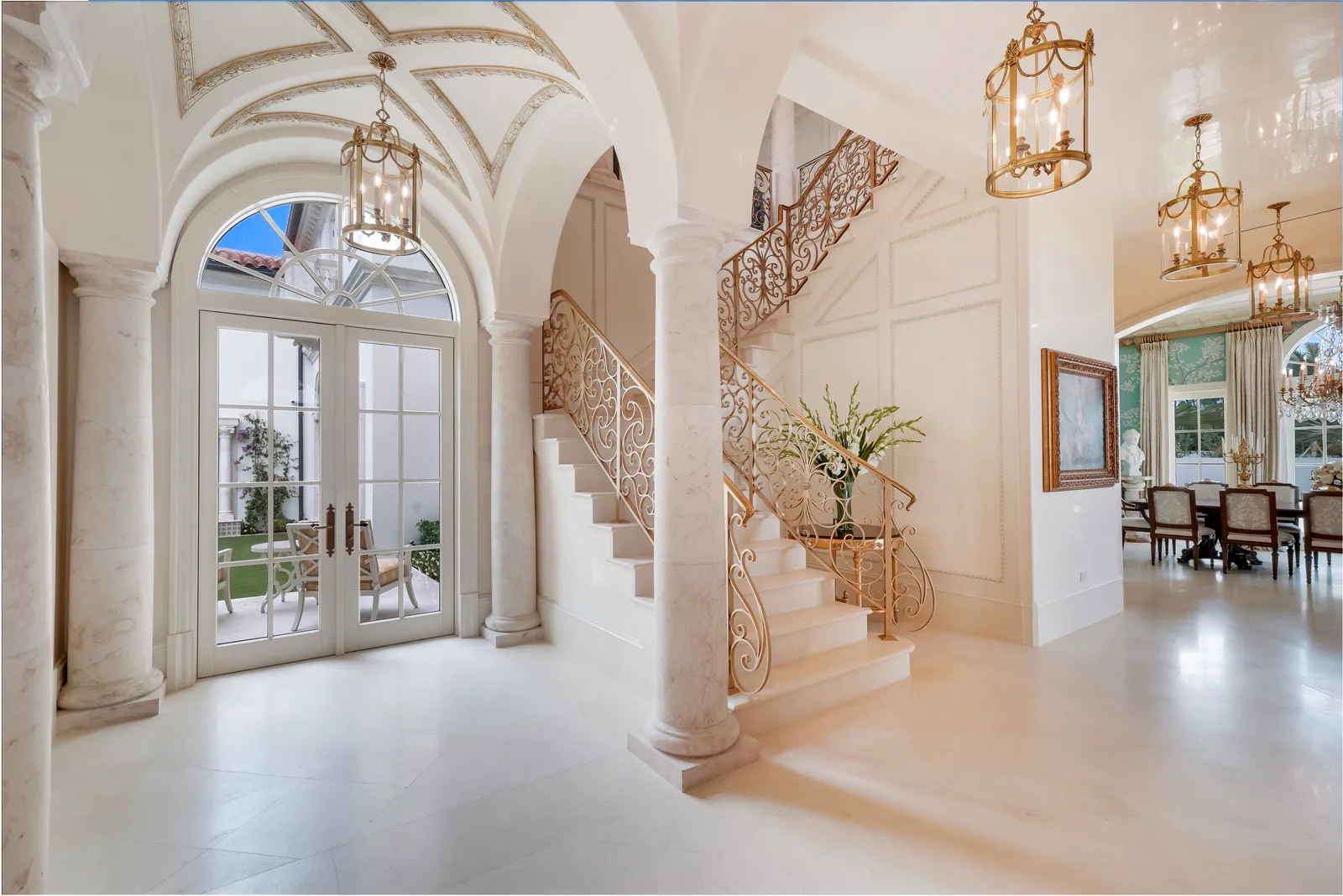 Arched gallery with columns and a view into the dining room