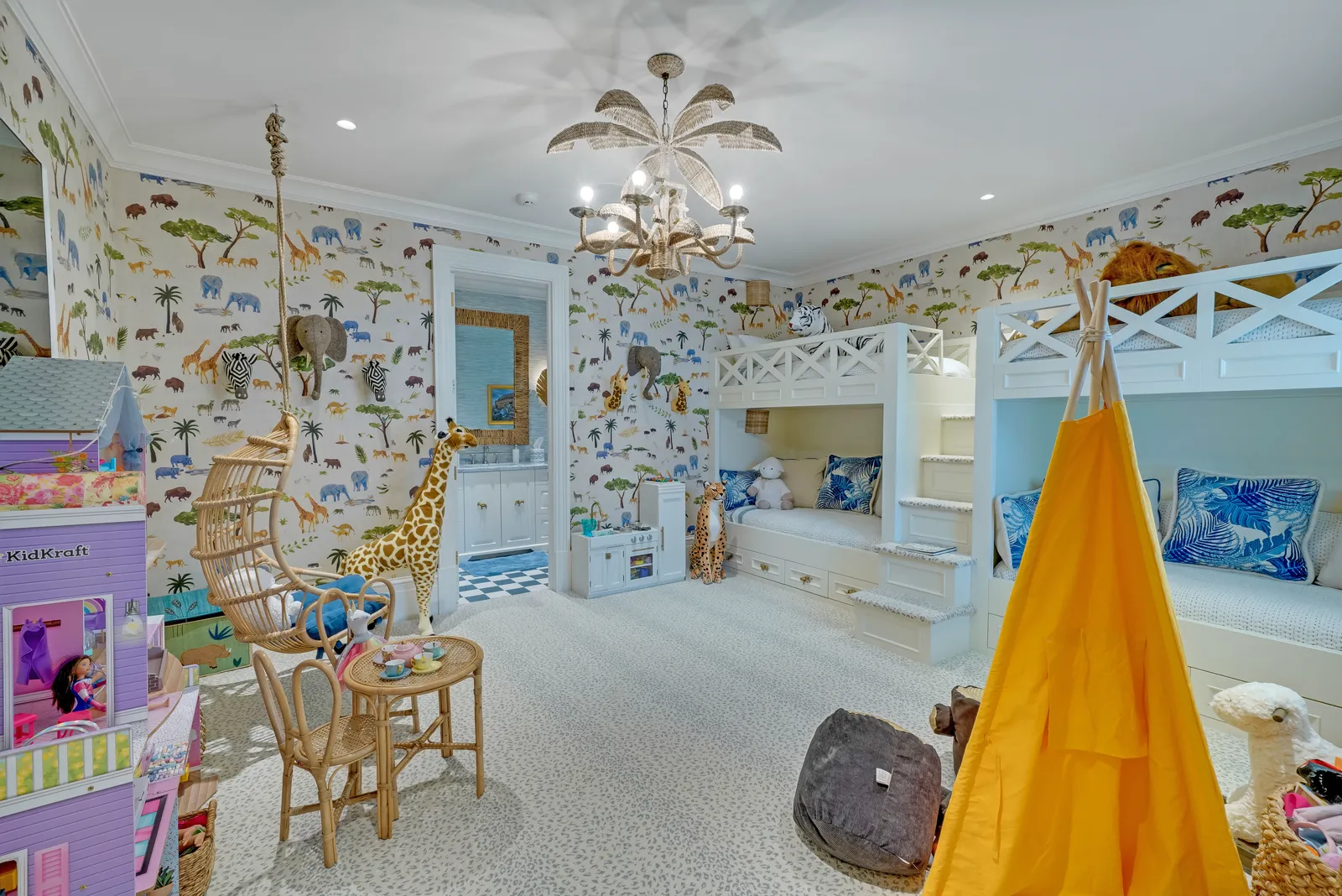 Child's bedroom with built-in bunk beds and painted wallpaper