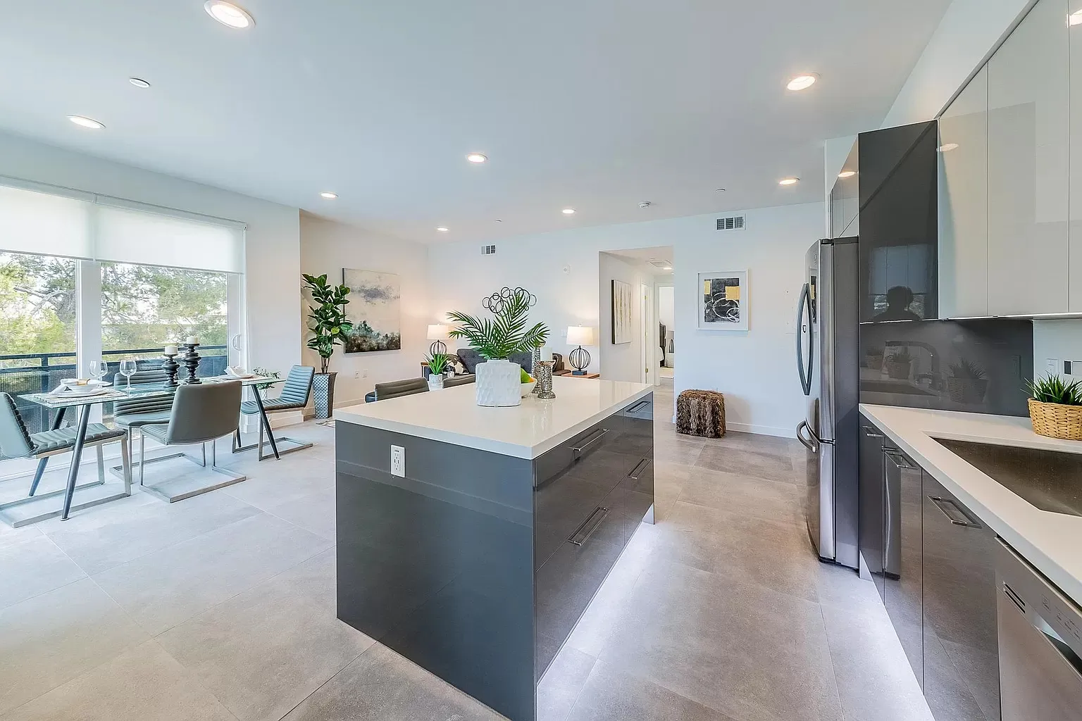 Kitchen island with under-cabinet lighting and the living area beyond