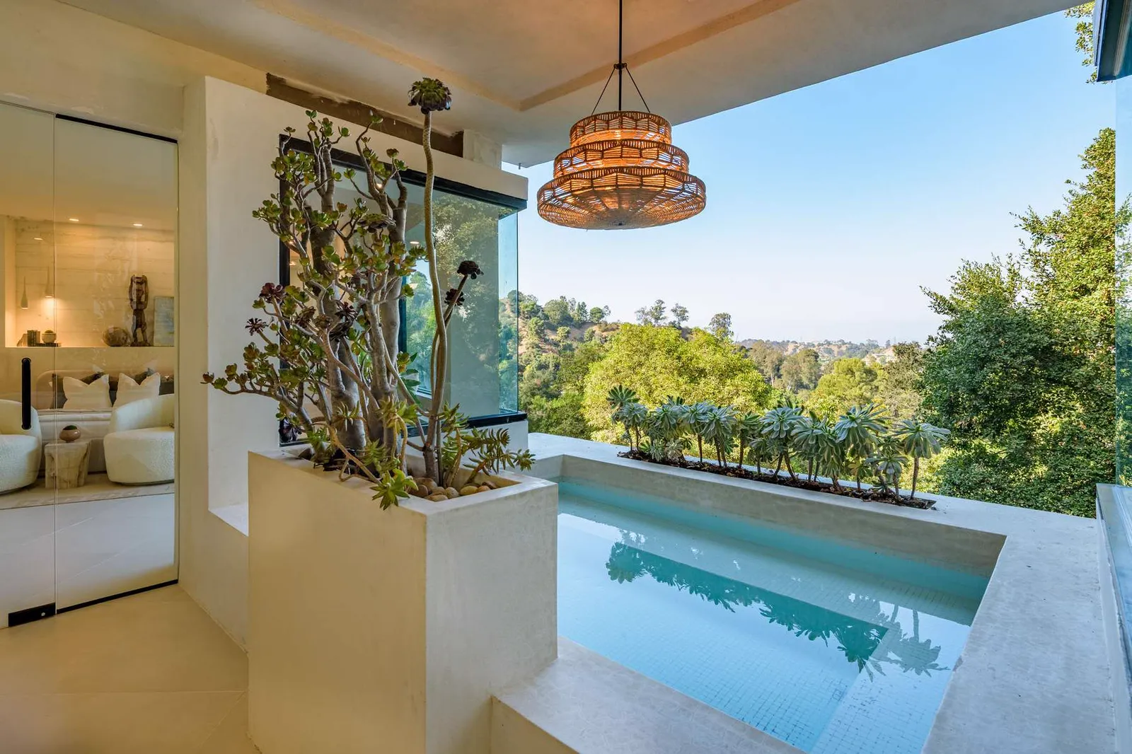 Bedroom balcony overlooking a plunge pool and the hills