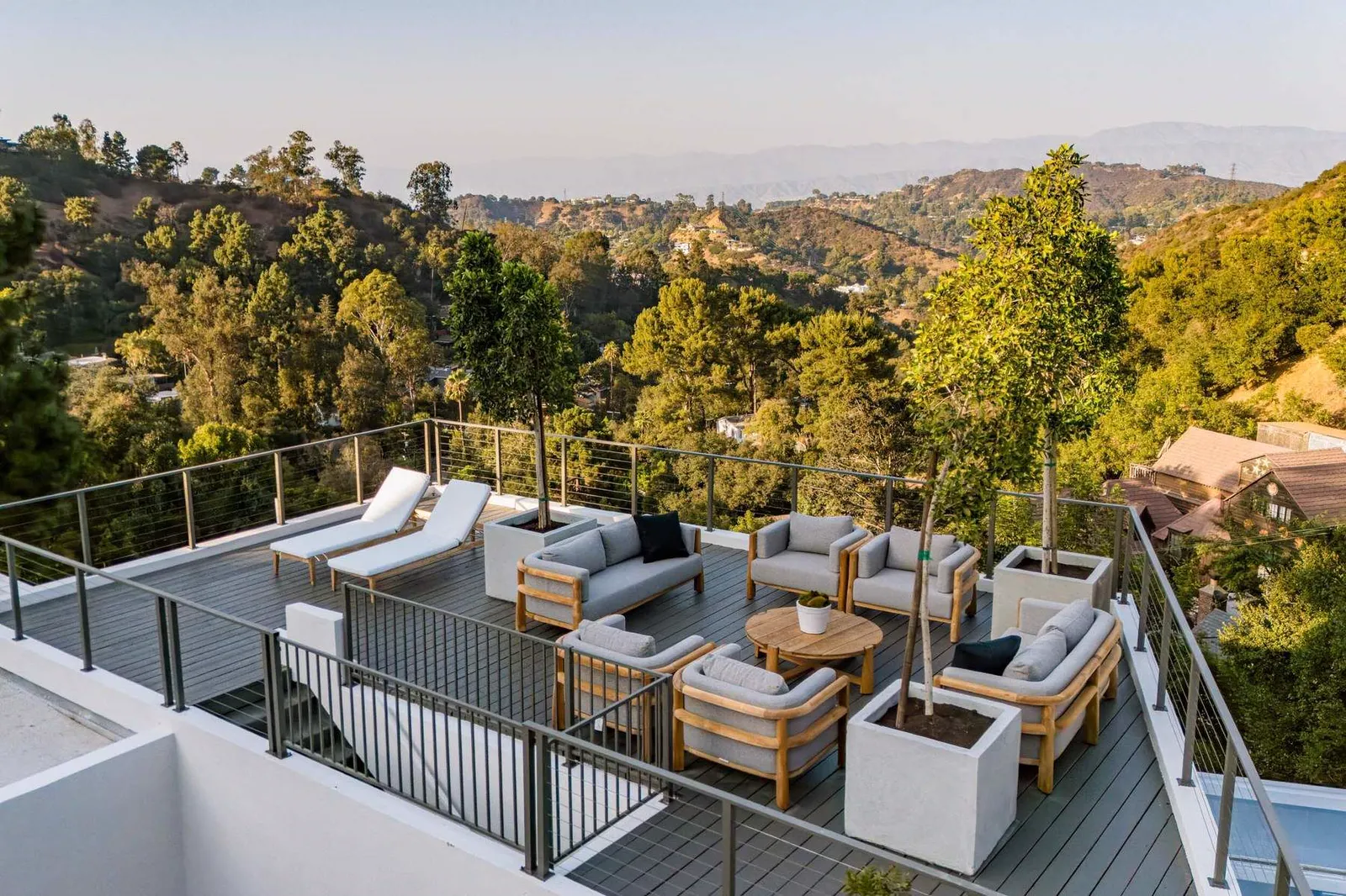 Roof deck with outdoor sofas overlooking the hills
