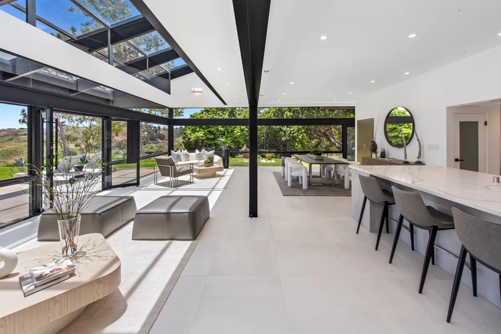 Open plan with a dining table and kitchen counter seating