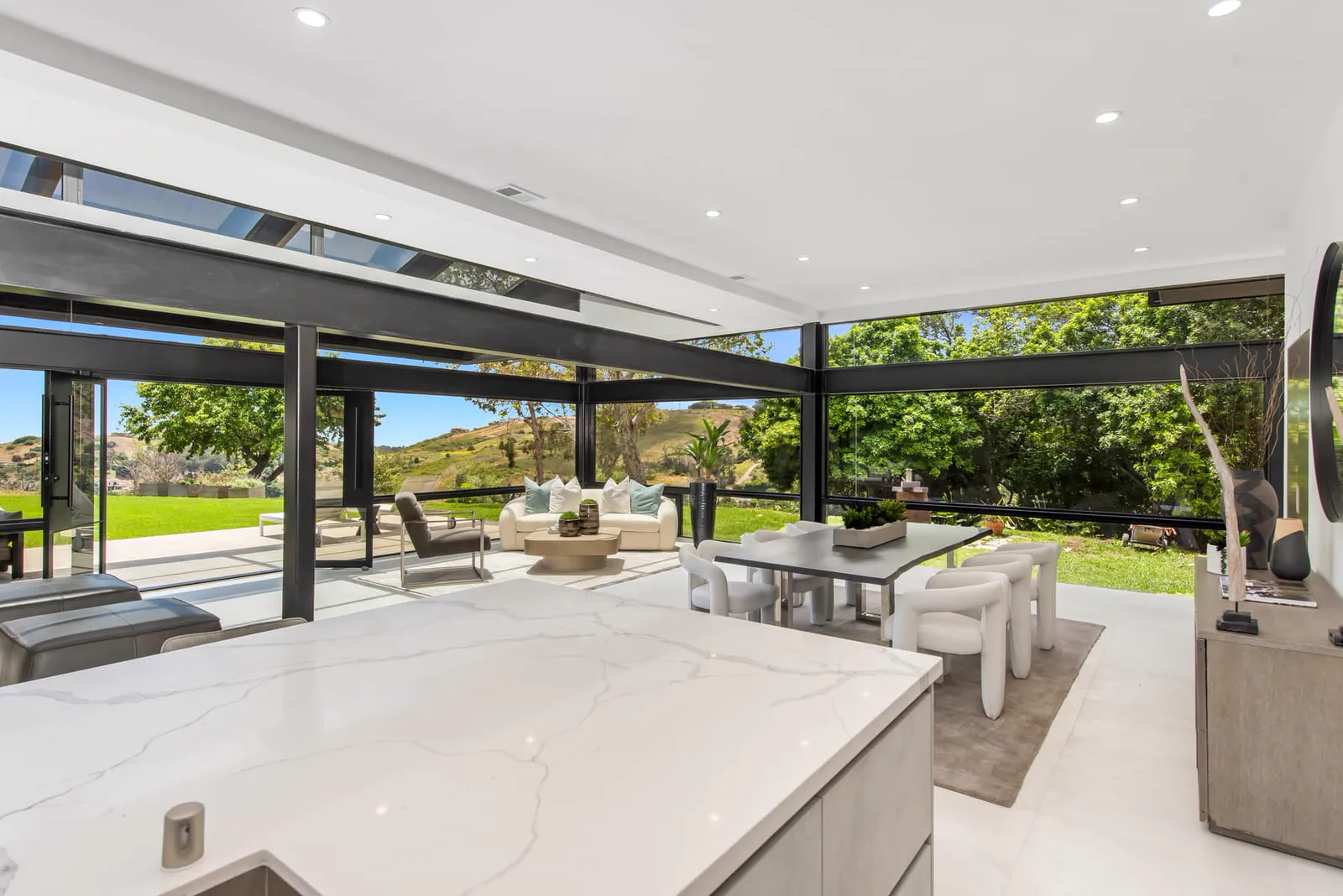 Kitchen island and dining area opening to the garden