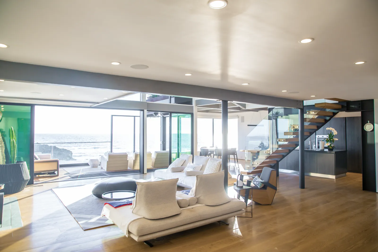 Living room with ocean views and an open stair