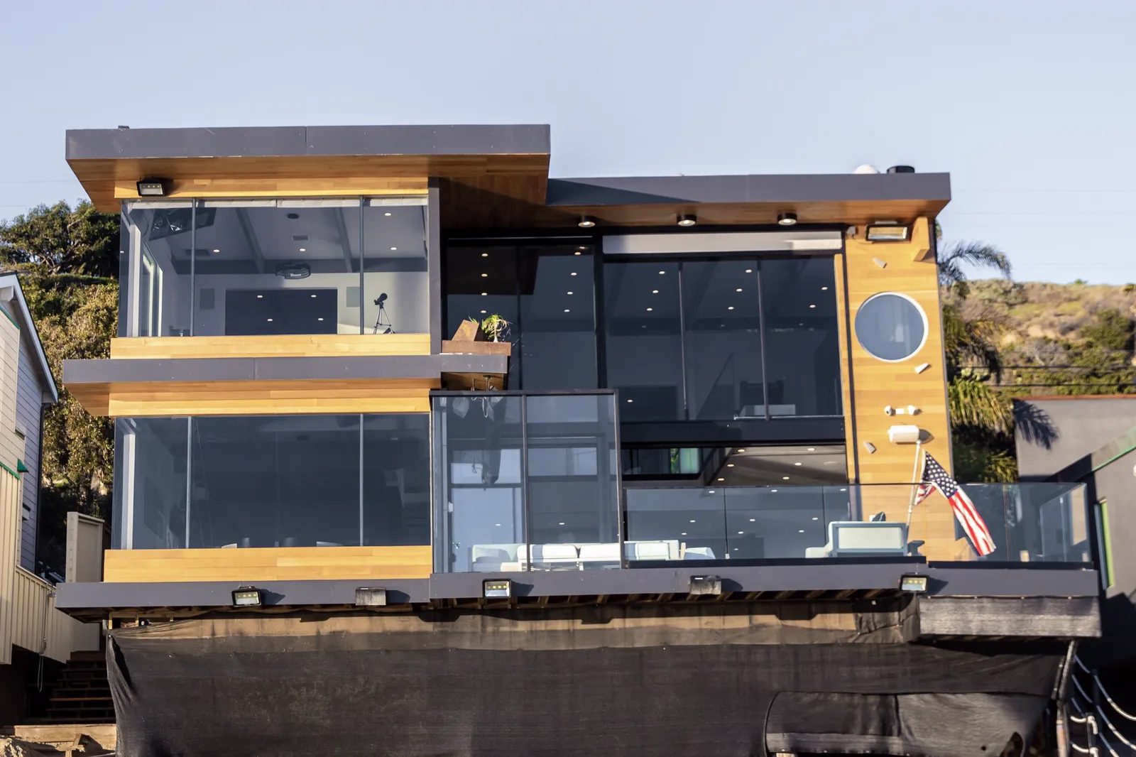 Beach side of the house with glass balconies