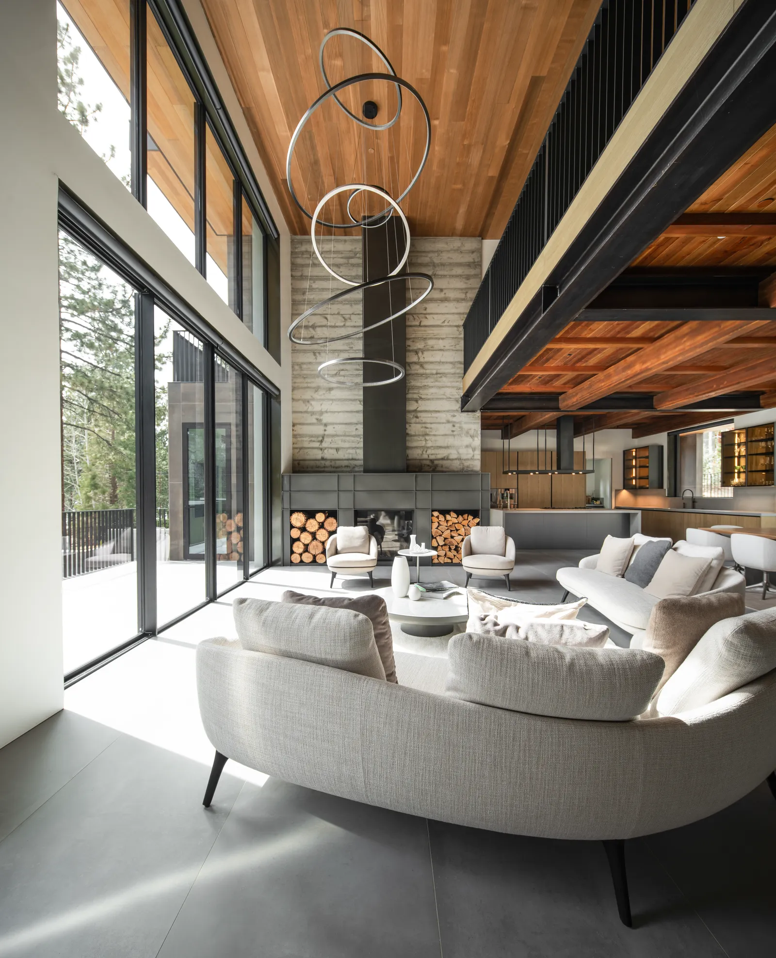 Living room with a curved sofa under a double-height wood ceiling