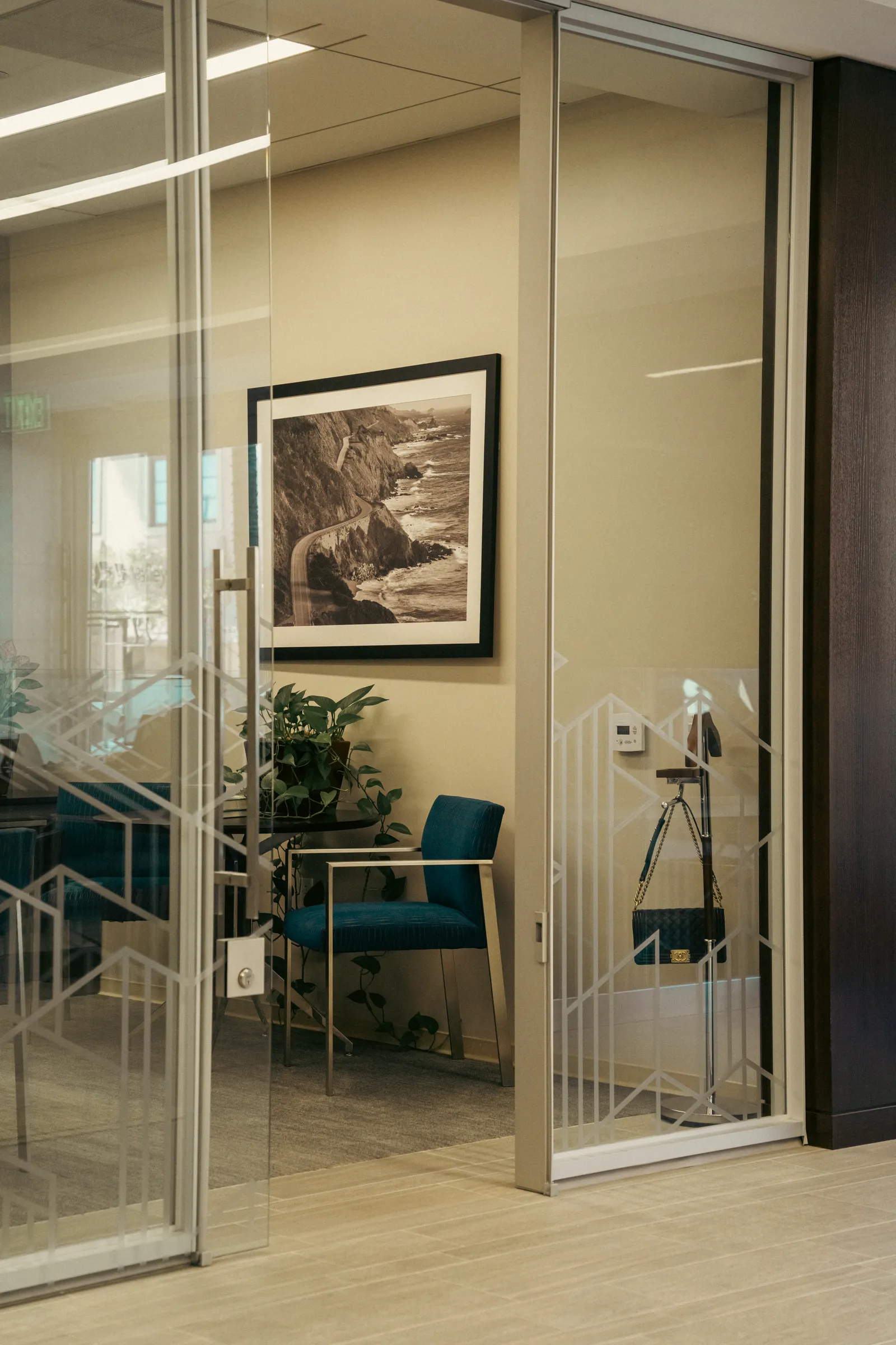 Glass-walled office seen from the corridor