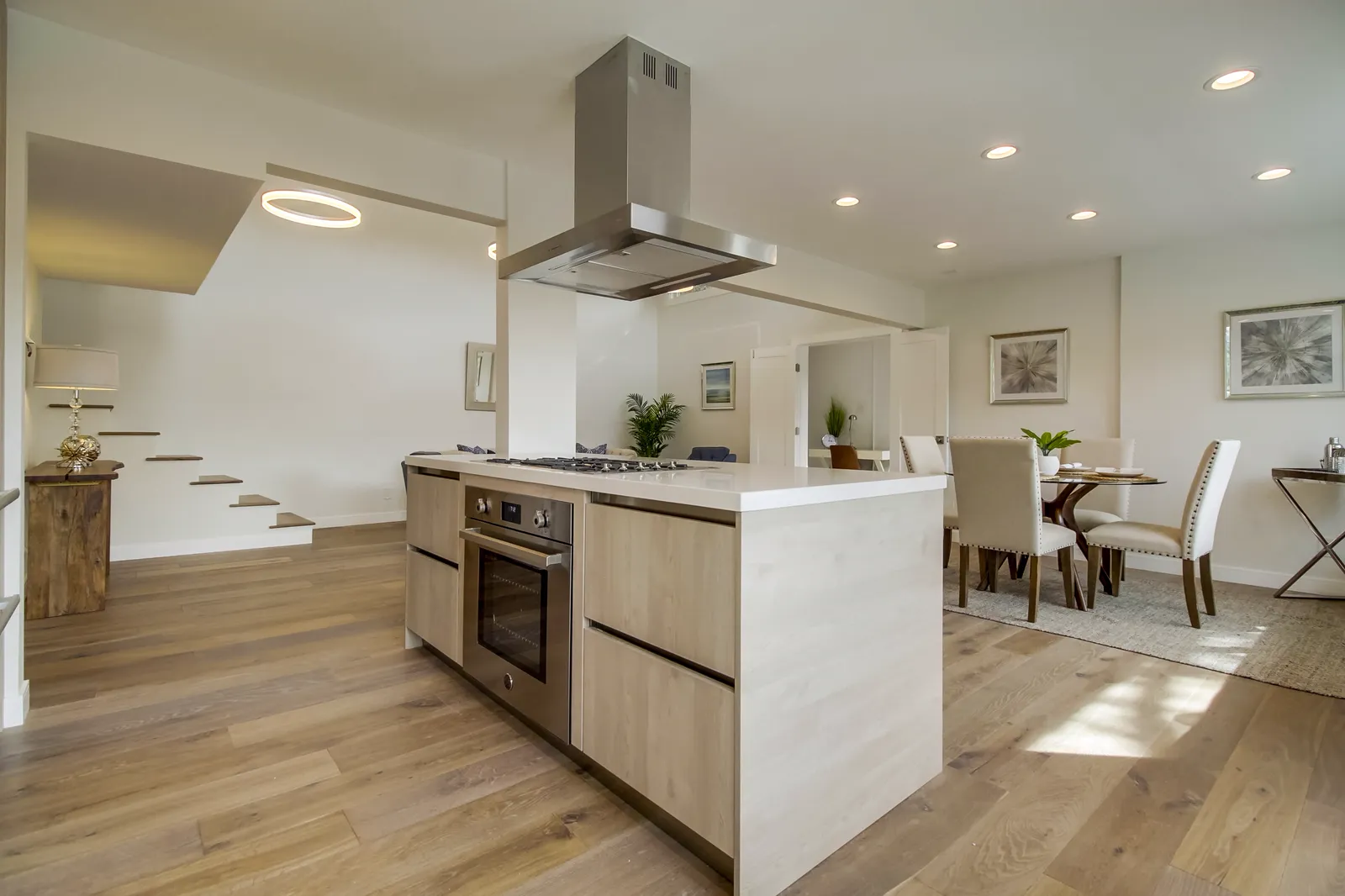 Kitchen island open to the dining area where a wall once stood